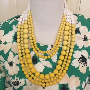 Yellow and white 5-string beaded necklace